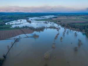 Image of flooding across fields and vegetation