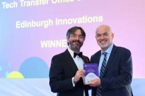 Dr George Baxter, Edinburgh Innovations CEO, receives the award for Tech Transfer Office of the Year