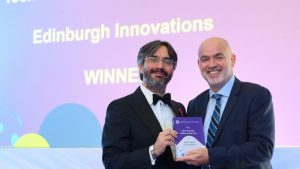 Dr George Baxter, Edinburgh Innovations CEO, receives the award for Tech Transfer Office of the Year