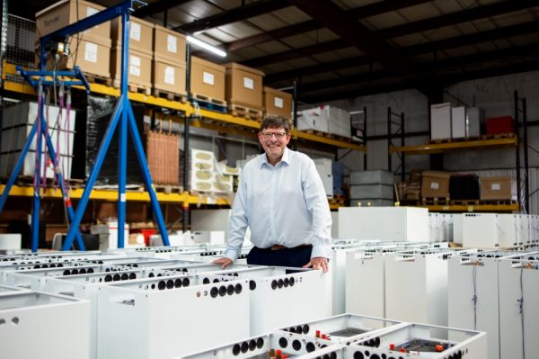 Andrew Bissell, founder and CEO, Sunamp in a factory with heat batteries