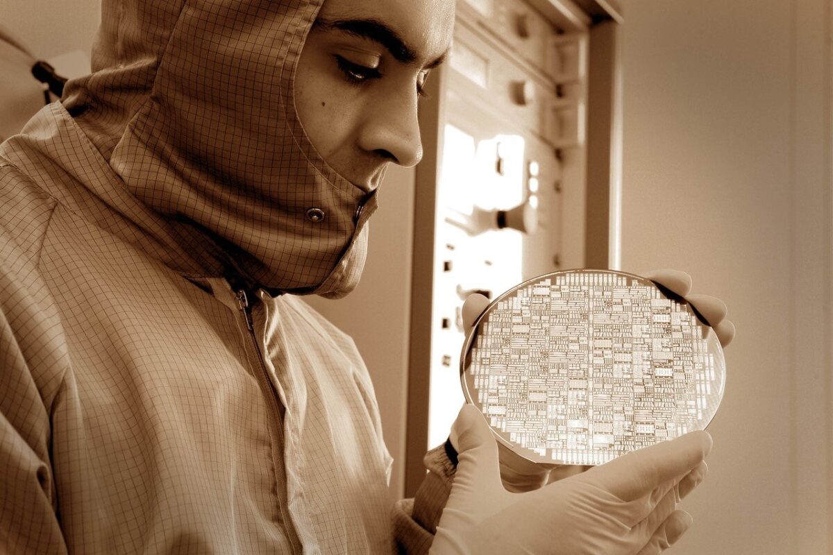 Themis Prodromakis with a silicon wafer semiconductor CREDIT Edinburgh Innovations